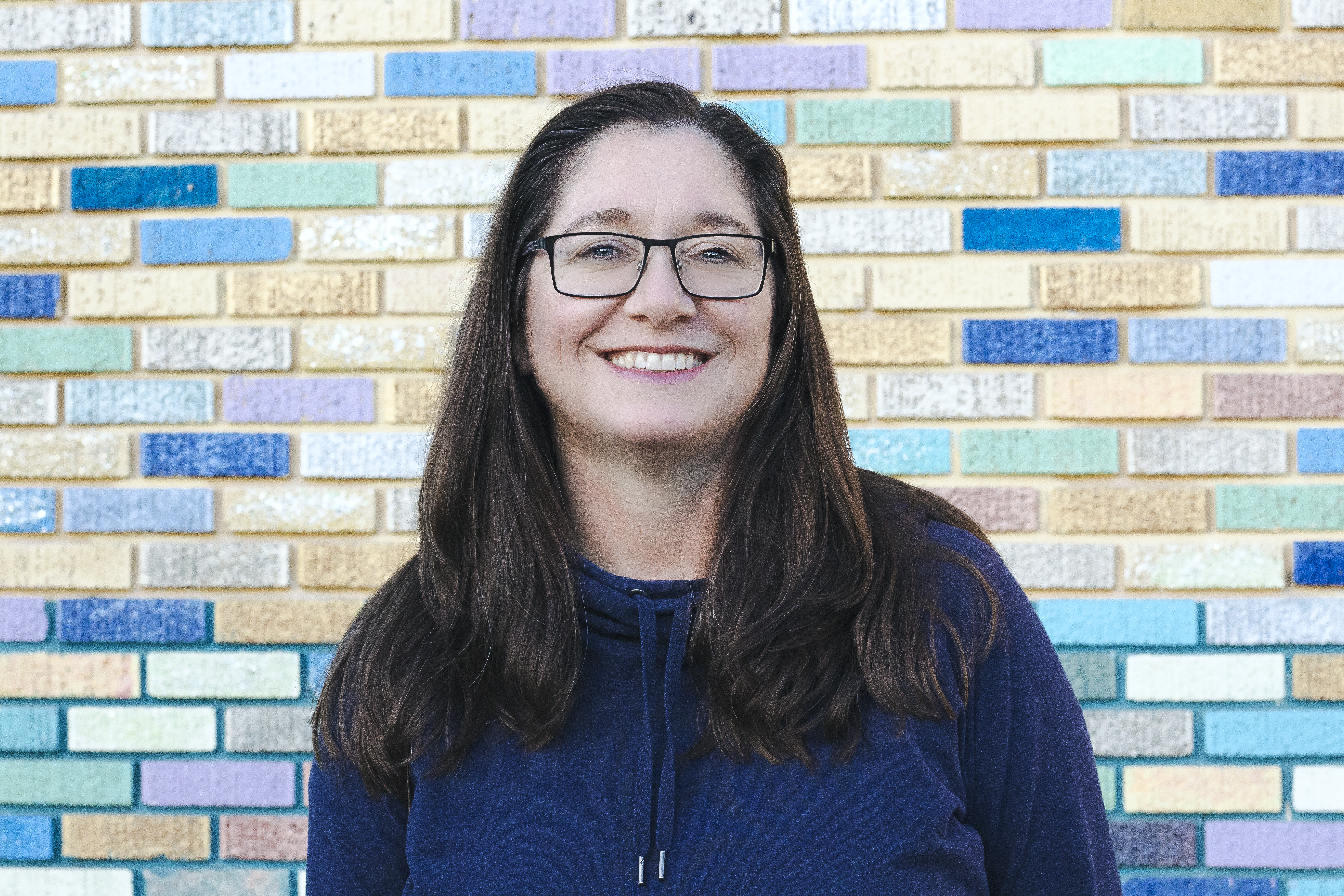 Tisha_Smiling_Golden_Wall