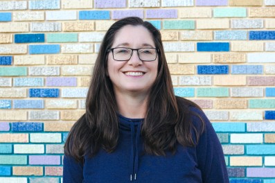 Tisha_Smiling_Golden_Wall